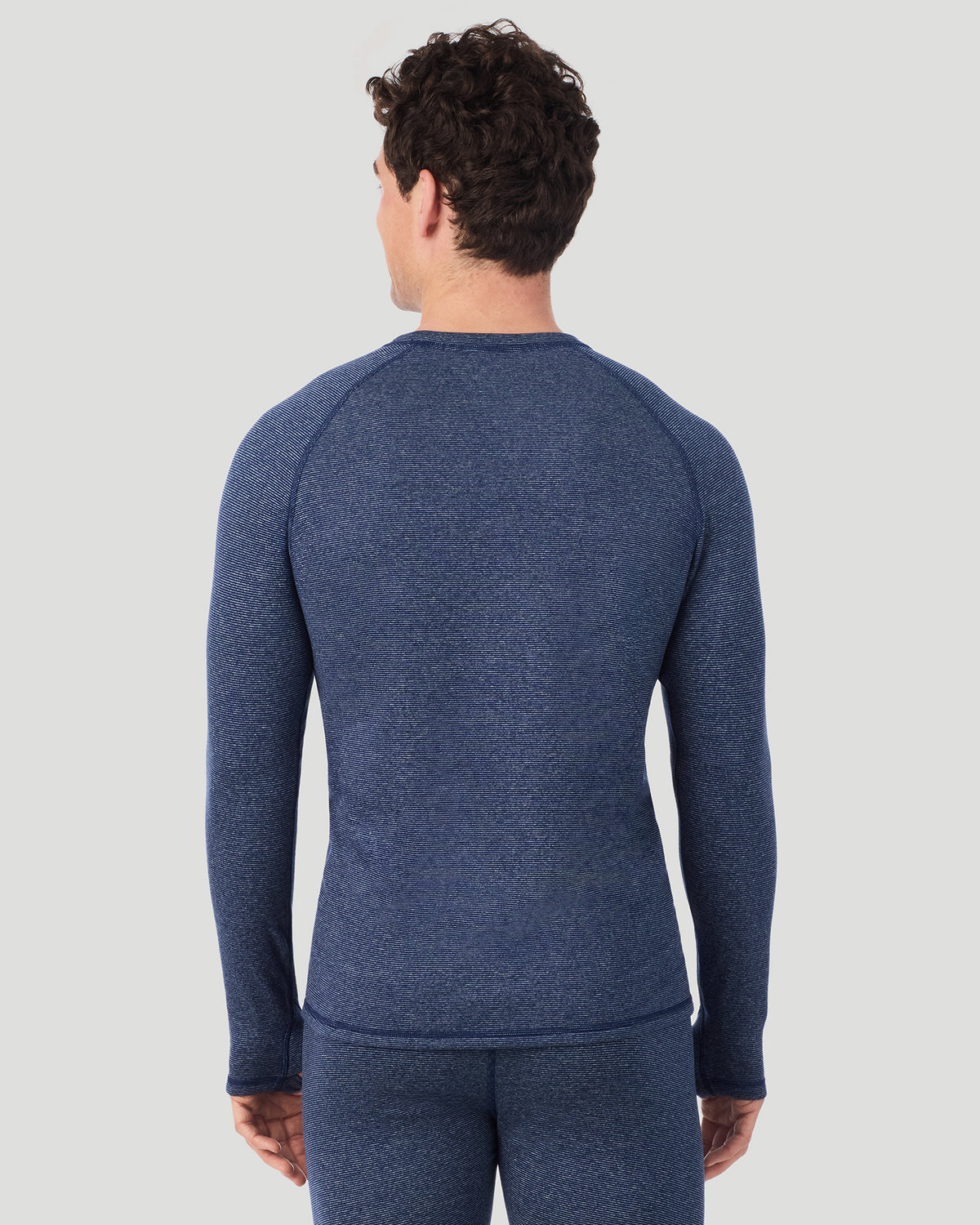  A man wearing Navy Stripe FlexStripe Long Sleeve Crew in a back view pose