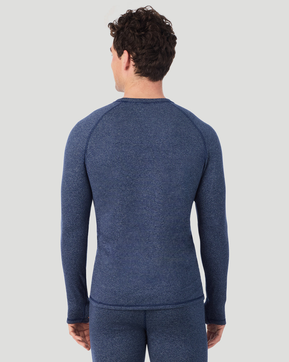 A man wearing Navy Stripe FlexStripe Long Sleeve Crew in a back view pose
