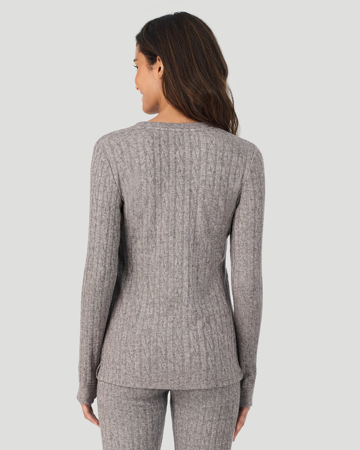 Light Grey Heather; Model is wearing a size S. She is 5’10”, Bust 33.5”, Waist 25”, Hips 36”. @A lady wearing Light Grey Heather Cable Knit Long Sleeve Crew in a back view pose