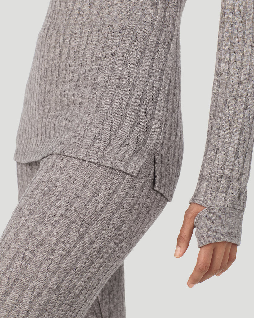 A lady wearing Light Grey Heather Cable Knit Long Sleeve Crew in a front view close up look of the fabric