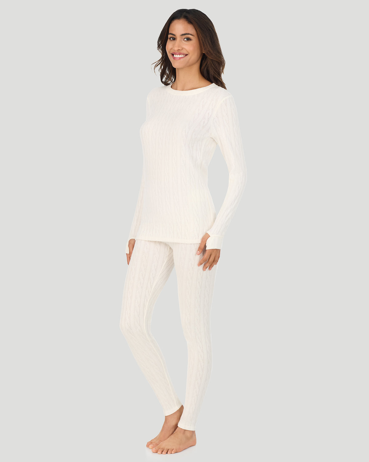 A lady wearing Vanilla Ice Cable Knit Long Sleeve Crew in a front view standing pose