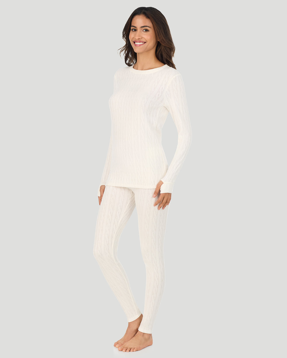 A lady wearing Vanilla Ice Cable Knit Long Sleeve Crew in a front view standing pose