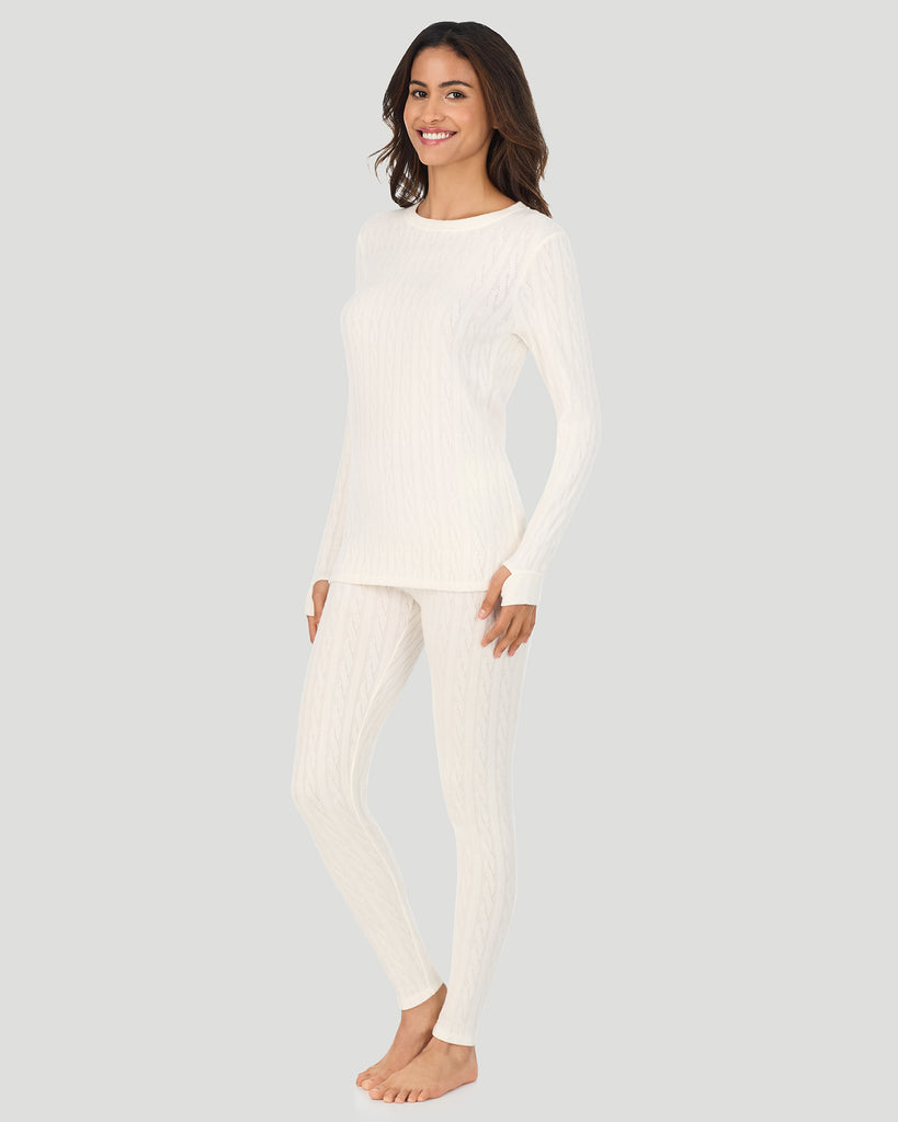 A lady wearing Vanilla Ice Cable Knit Long Sleeve Crew in a front view standing pose