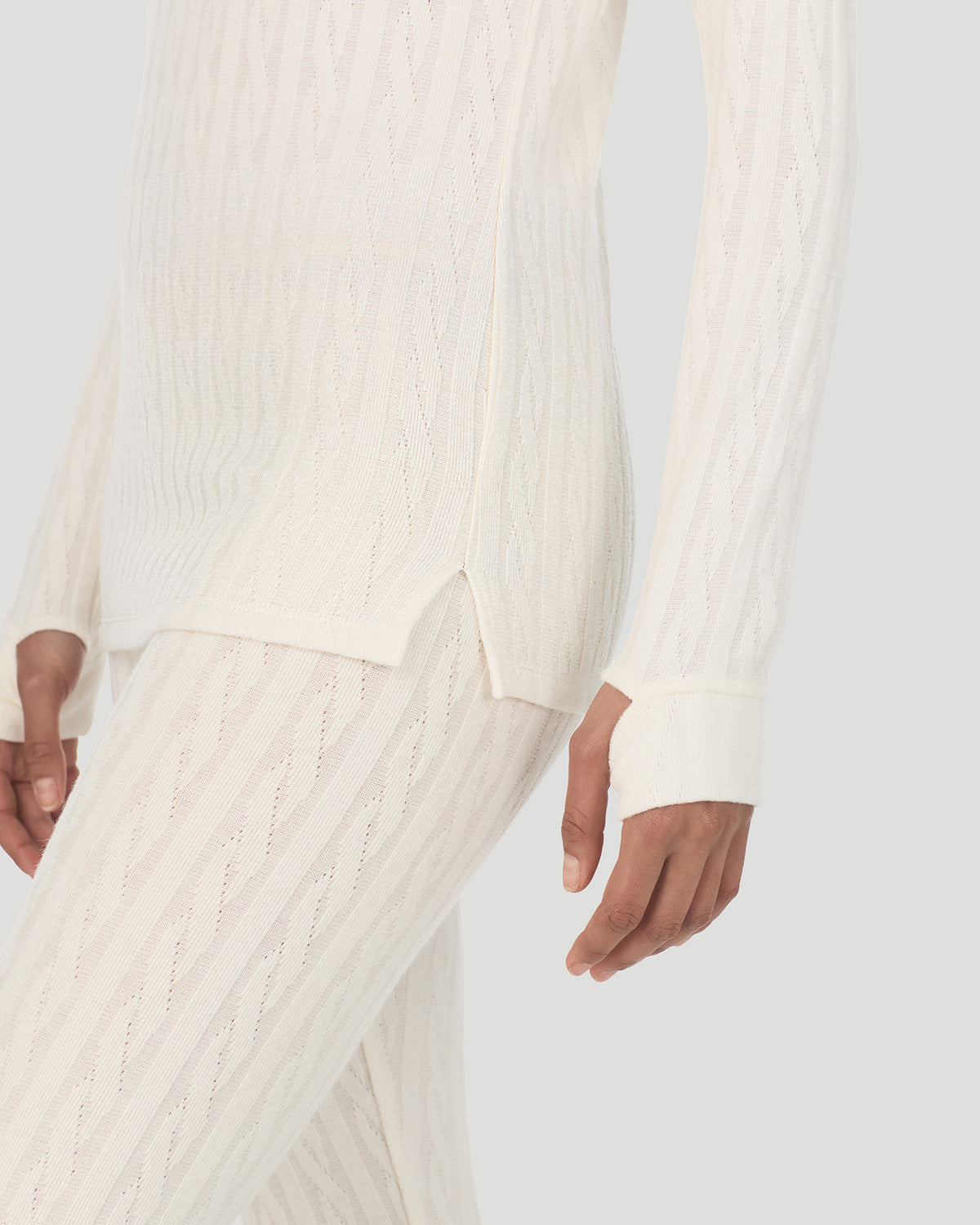 Vanilla Ice; Model is wearing a size S. She is 5’10”, Bust 33.5”, Waist 25”, Hips 36”. @A lady wearing Vanilla Ice Cable Knit Long Sleeve Crew in a front view detail close up look