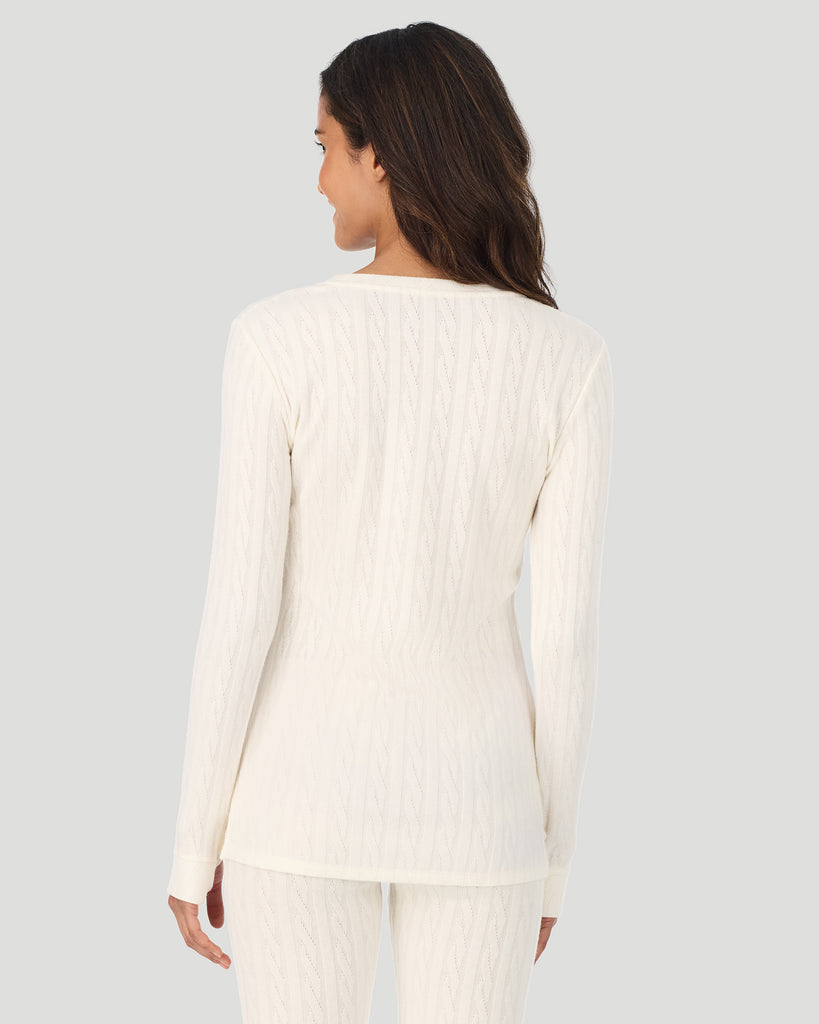 A lady wearing Vanilla Ice Cable Knit Long Sleeve Crew in a back view pose