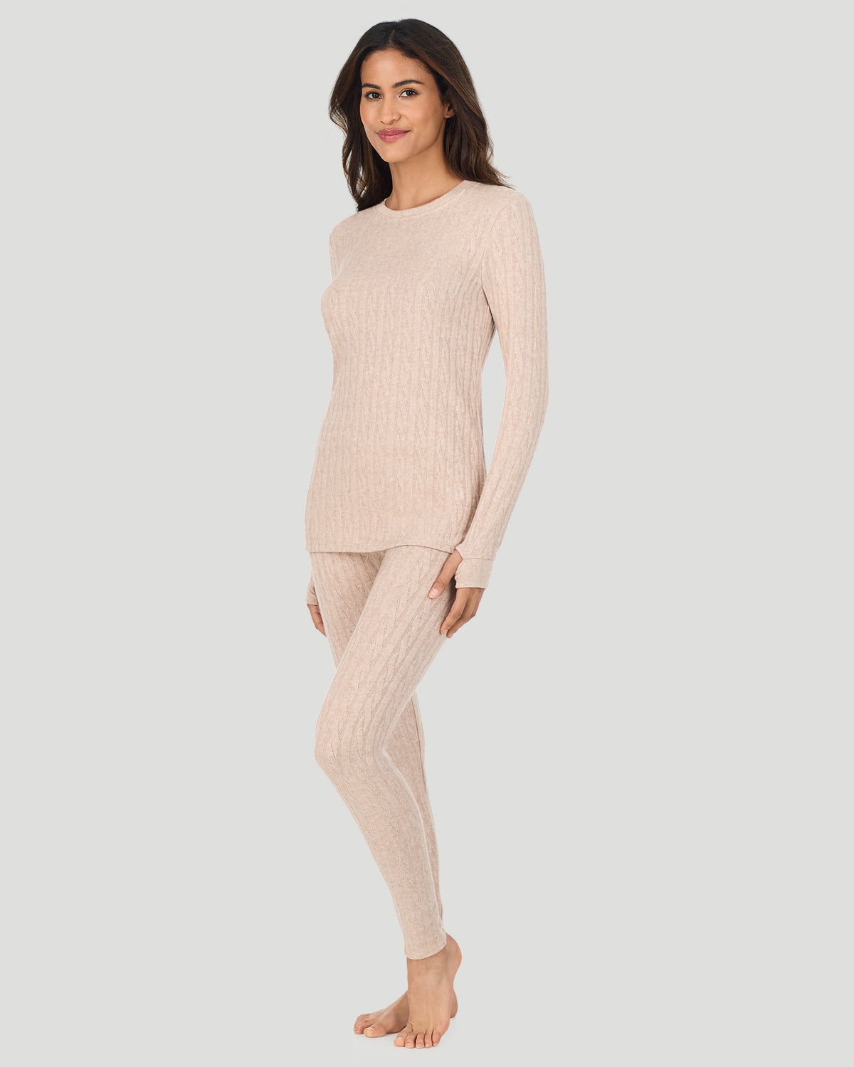 A lady wearing Oatmeal Heather Cable Knit Long Sleeve Crew in a front view side angle pose