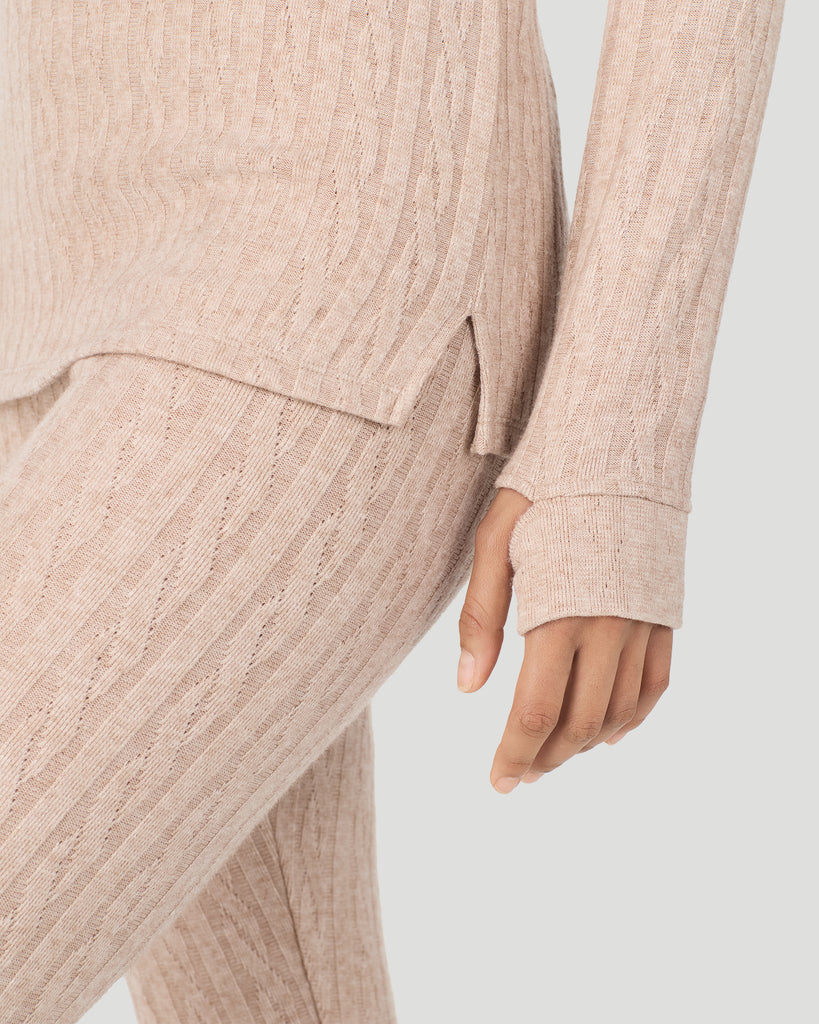 A lady wearing Oatmeal Heather Cable Knit Long Sleeve Crew in a front view detail close up look