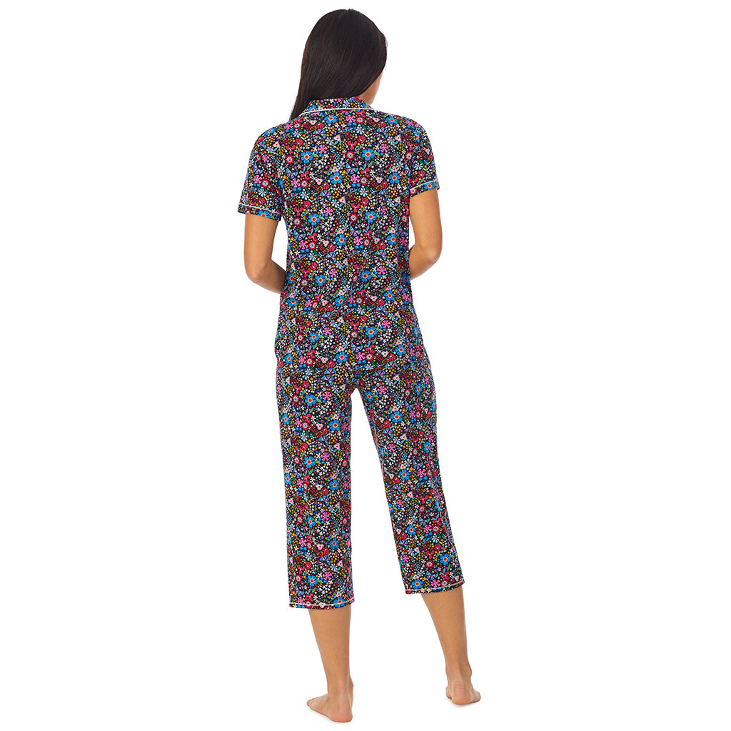 Spring Bloom; Model is wearing size S. She is 5'8.5", Bust 32", Waist 25", Hips 36".@A lady wearing Short Sleeve Notch Collar pajama set with floral print