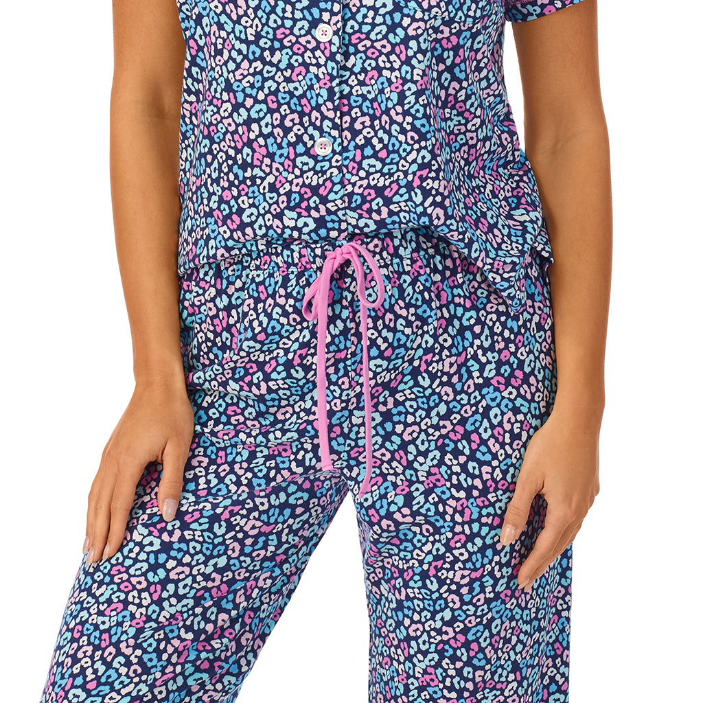 Multi Animal; Model is wearing size S. She is 5'8.5", Bust 32", Waist 25", Hips 36".@A lady wearing short sleeve notch collar pajama set with multi animal print