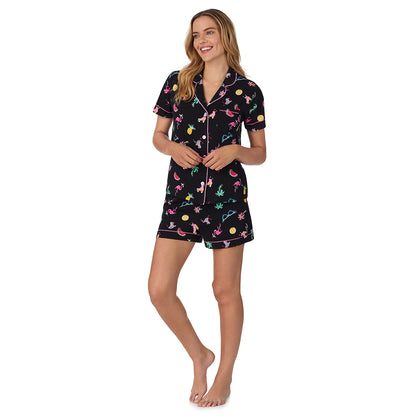 Summer Graphic; Model is wearing size S. She is 5’10”, Bust 34”, Waist 26", Hips 38”.@A lady wearing black Short Sleeve Notch Collar with Boxer Short pajama set with summer graphic print