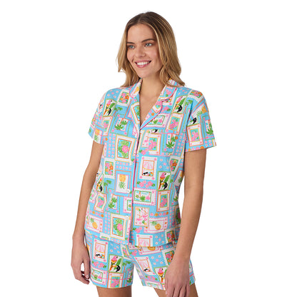 Summer Frame; Model is wearing size S. She is 5’10”, Bust 34”, Waist 26", Hips 38”.@A lady wearing blue Short Sleeve Notch Collar with Boxer Short pajama set with summer frames print