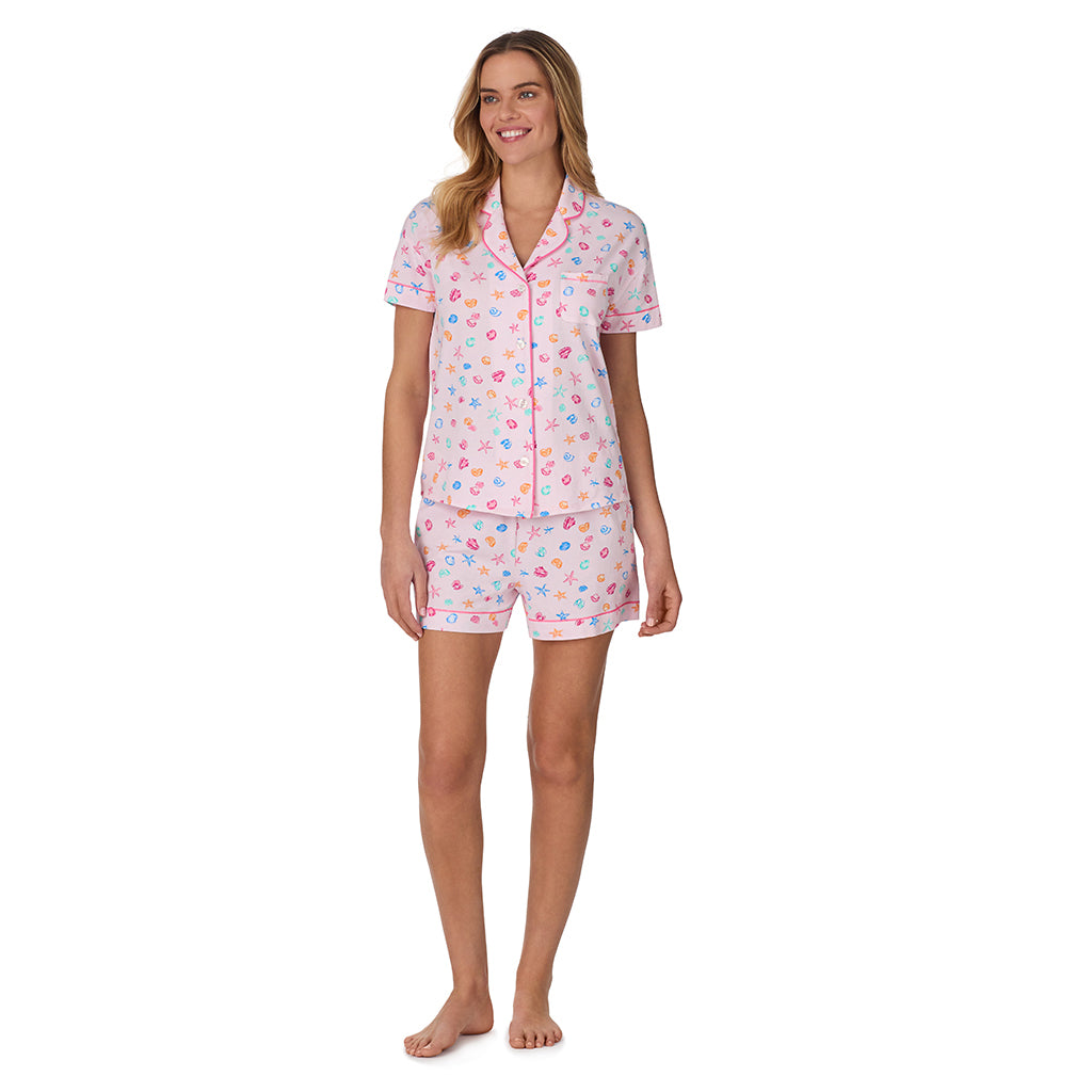 Seashell; Model is wearing size S. She is 5’10”, Bust 34”, Waist 26", Hips 38”.@A lady wearing pink Short Sleeve Notch Collar with Boxer Short pajama set with Seashell print