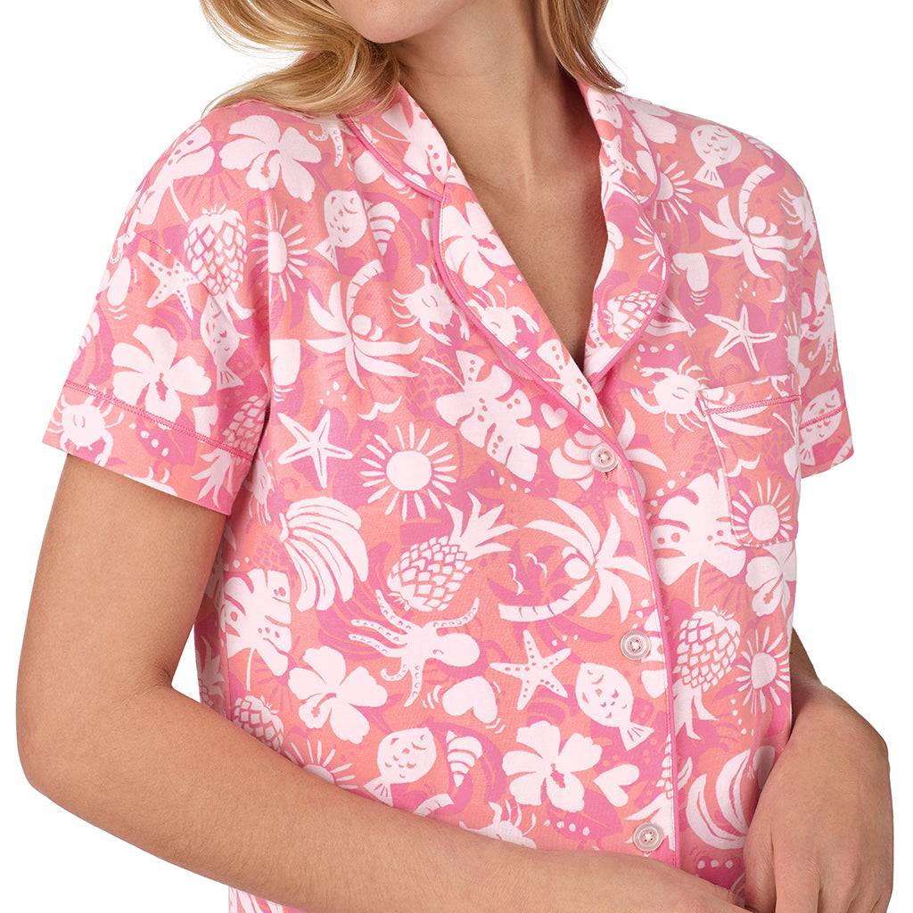 Coral Tropical;Model is wearing size S. She is 5’10”, Bust 34”, Waist 26", Hips 38”.@A lady wearing pink Short Sleeve Notch Collar with Boxer Short pajama set with coral tropical print
