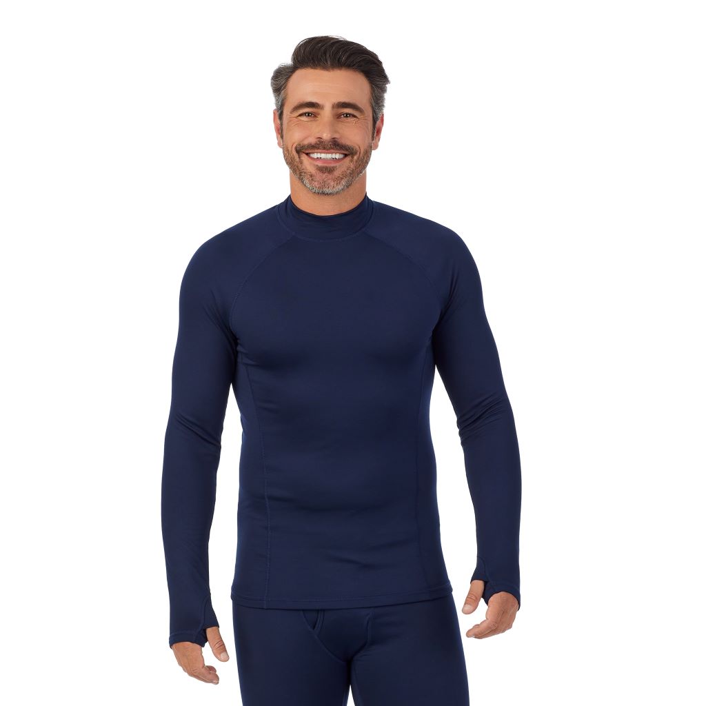 Black;Model is wearing size M. He is 6'2", Waist 32", Inseam 34".@A man wearing black ArctiCore Long Sleeve Mock Neck