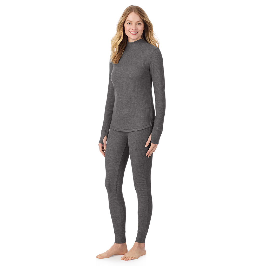  A lady is wearing a stone grey heather Cozy Stretch Thermal Long Sleeve Mock Neck