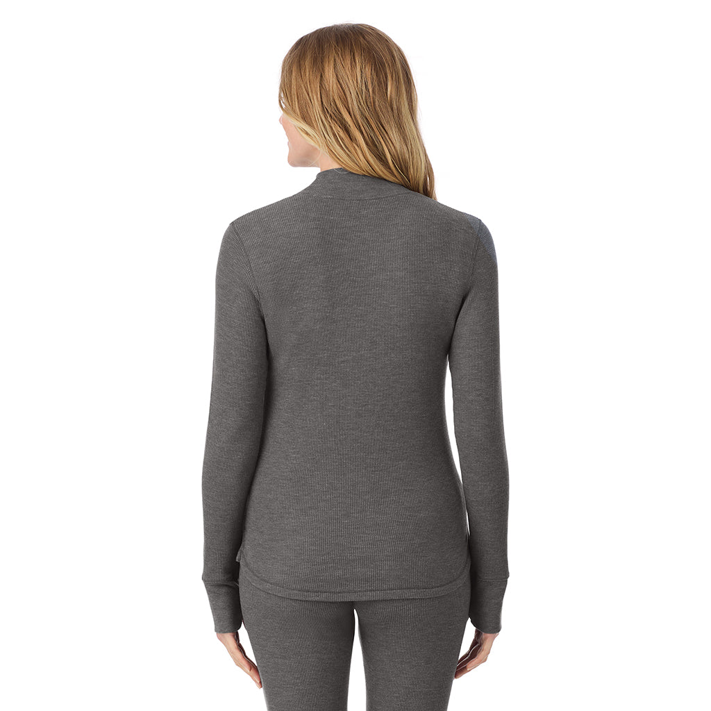  A lady is wearing a stone grey heather Cozy Stretch Thermal Long Sleeve Mock Neck