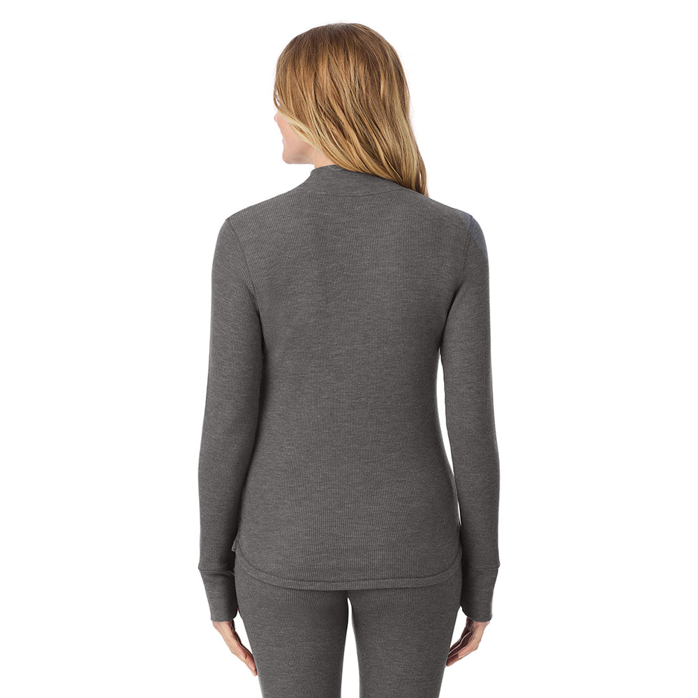 A lady is wearing a stone grey heather Cozy Stretch Thermal Long Sleeve Mock Neck