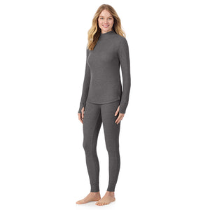  A lady is wearing a stone grey heather Cozy Stretch Thermal Long Sleeve Mock Neck