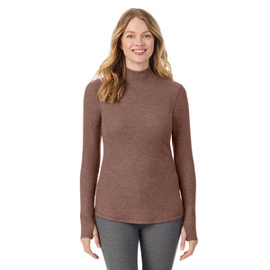  A lady is wearing a deep mahogany heather Cozy Stretch Thermal Long Sleeve Mock Neck