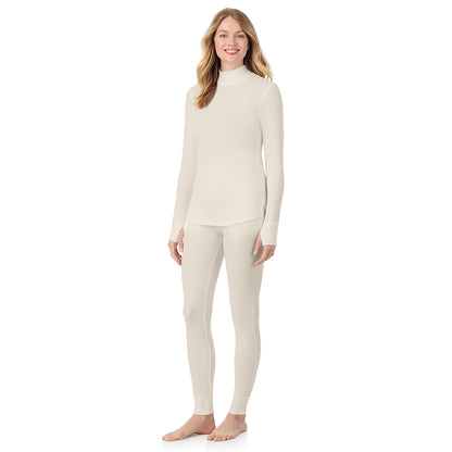 Ivory; Model is wearing size S. She is 5'11", Bust 33", Waist 24", Hips 34".@ A lady is wearing a ivory Cozy Stretch Thermal Long Sleeve Mock Neck