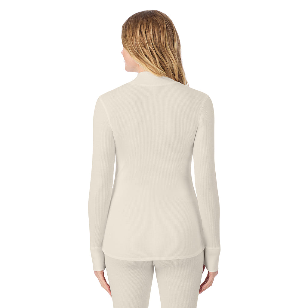 Ivory; Model is wearing size S. She is 5'11", Bust 33", Waist 24", Hips 34".@ A lady is wearing a ivory Cozy Stretch Thermal Long Sleeve Mock Neck