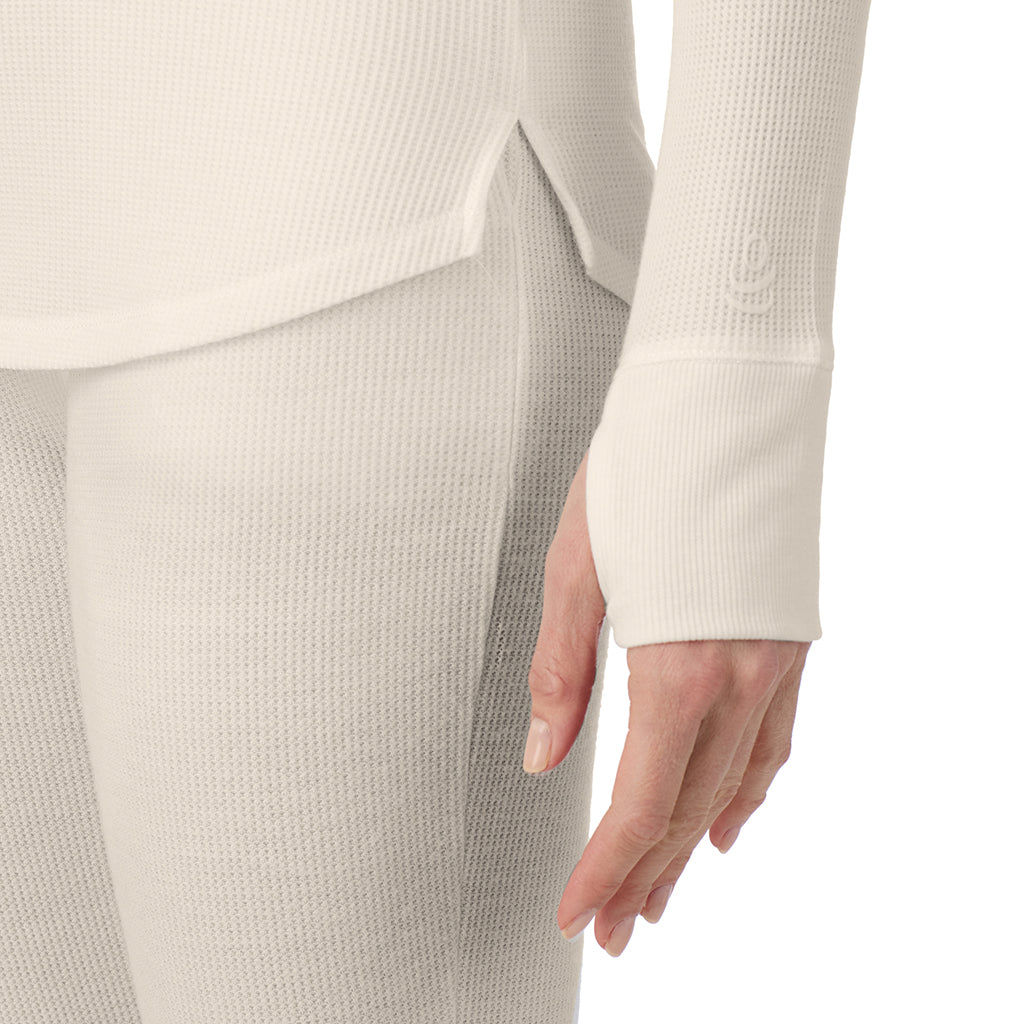  A lady is wearing a ivory Cozy Stretch Thermal Long Sleeve Mock Neck