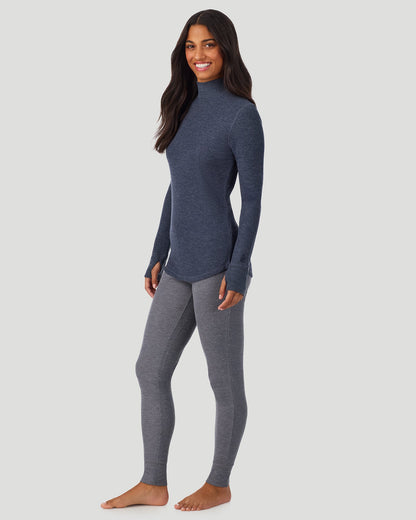 A lady wearing Cozy Stretch Thermal Long Sleeve Mock Neck in Medieval Blue Heather