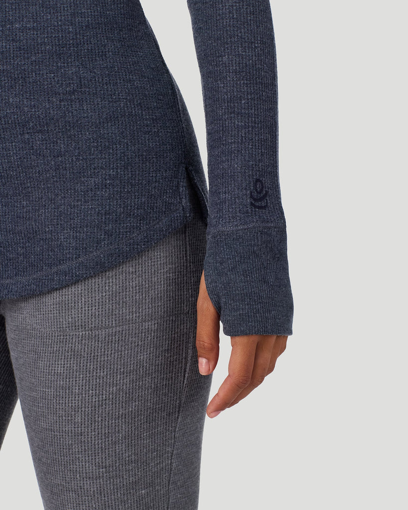  A lady wearing Medieval Blue Heather Cozy Stretch Thermal Long Sleeve Mock Neck in a front view detail close up look