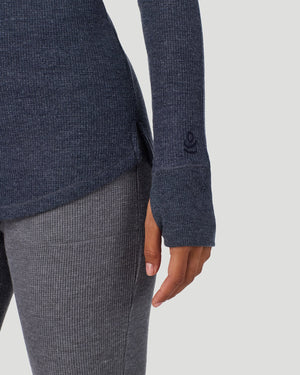  A lady wearing Medieval Blue Heather Cozy Stretch Thermal Long Sleeve Mock Neck in a front view detail close up look