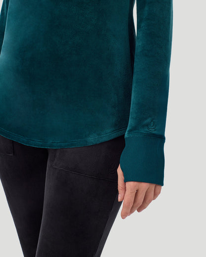 A lady wearing Stretch Velour Long Sleeve V-Neck in deep emerald shown in a front view close up detail pose