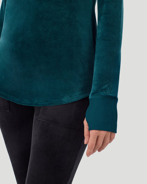 A lady wearing Stretch Velour Long Sleeve V-Neck in deep emerald shown in a front view close up detail pose