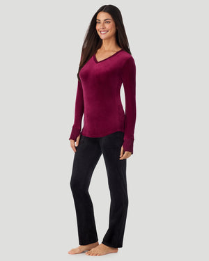 A lady wearing Stretch Velour Long Sleeve V-Neck in bordeaux shown in a front view standing pose