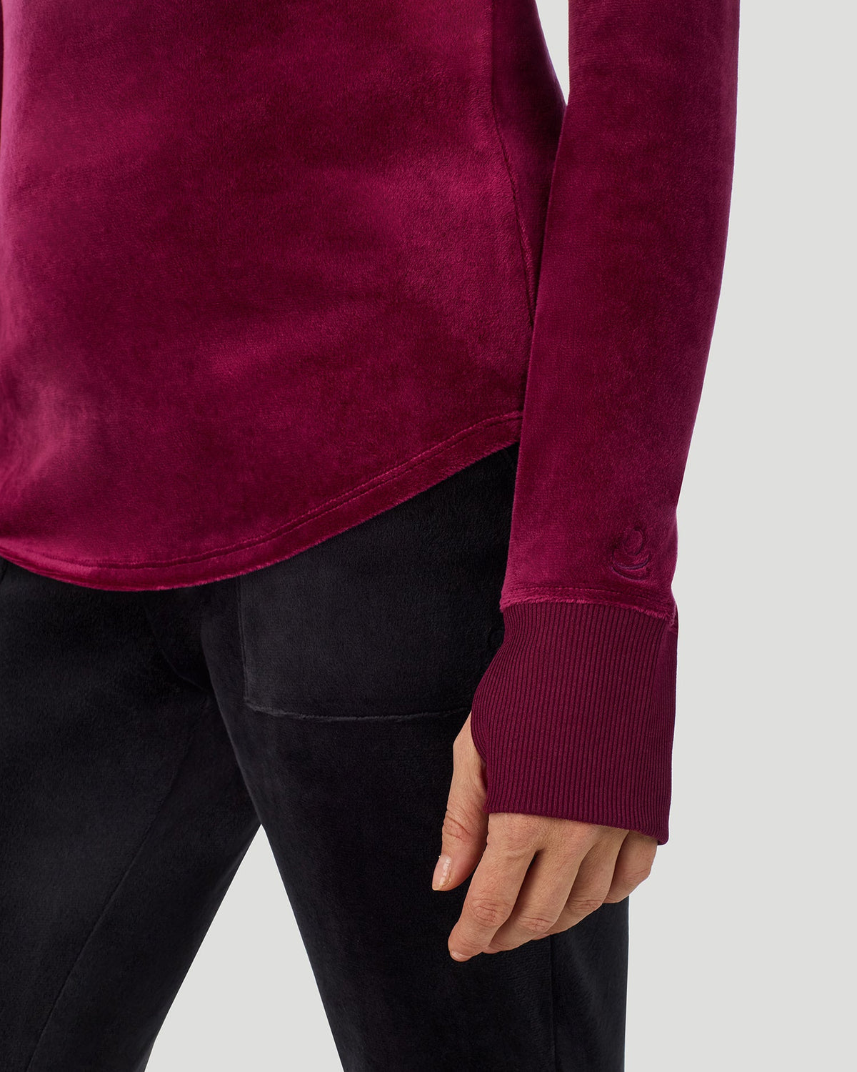 A lady wearing Stretch Velour Long Sleeve V-Neck in bordeaux shown in a front view close up detail pose