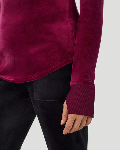 A lady wearing Stretch Velour Long Sleeve V-Neck in bordeaux shown in a front view close up detail pose