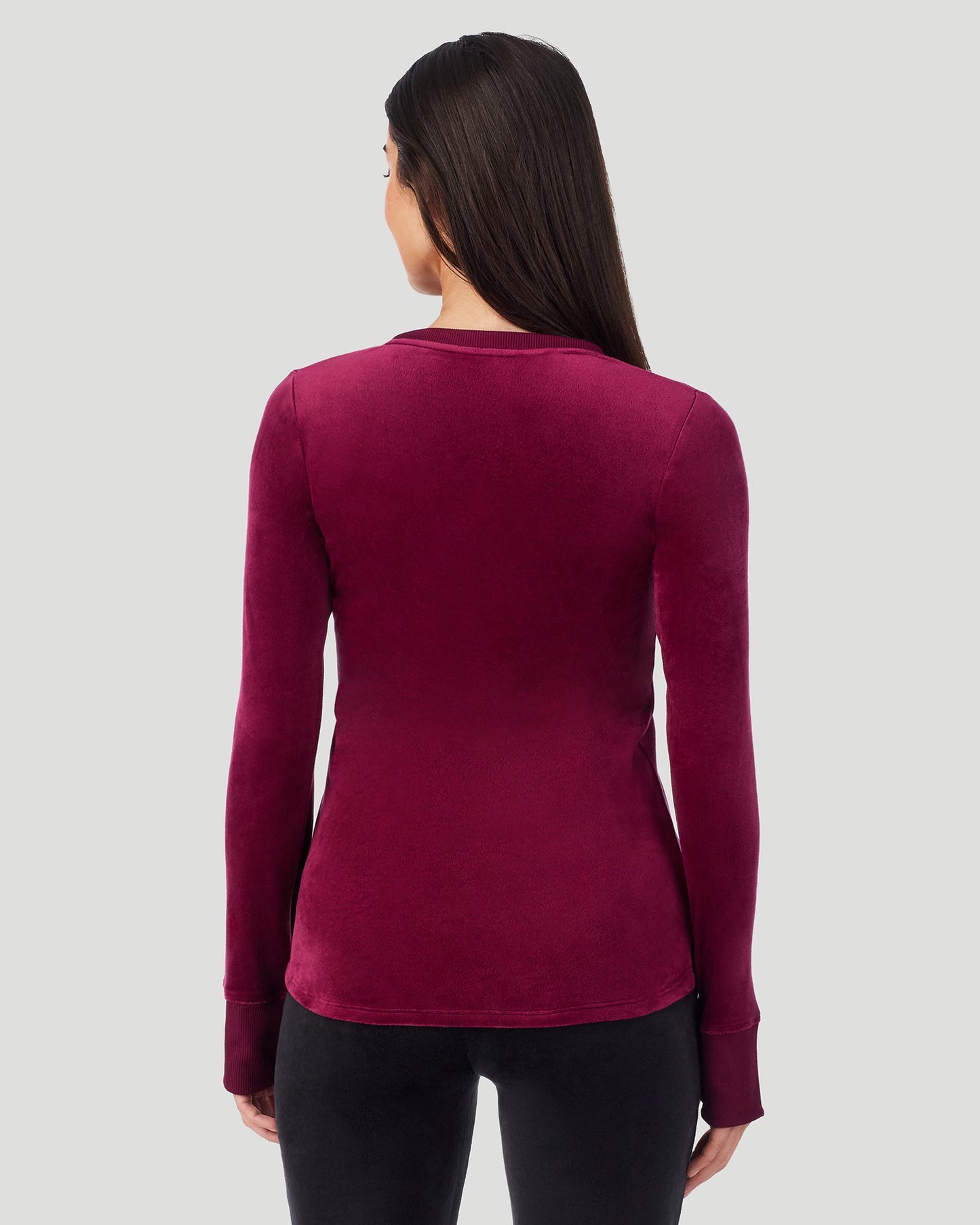 Bordeaux; Model is wearing a size S. She is 5’9”, Bust 34.5”, Waist 25”, Hips 36.5”. @A lady wearing Stretch Velour Long Sleeve V-Neck in bordeaux shown in a back view pose