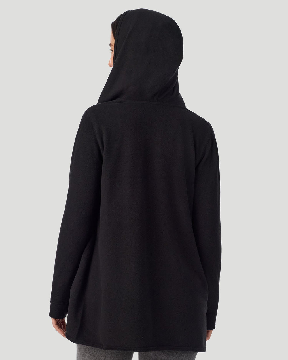 A lady wearing Fleecewear with Stretch Long Sleeve Wrap With Hood black back view