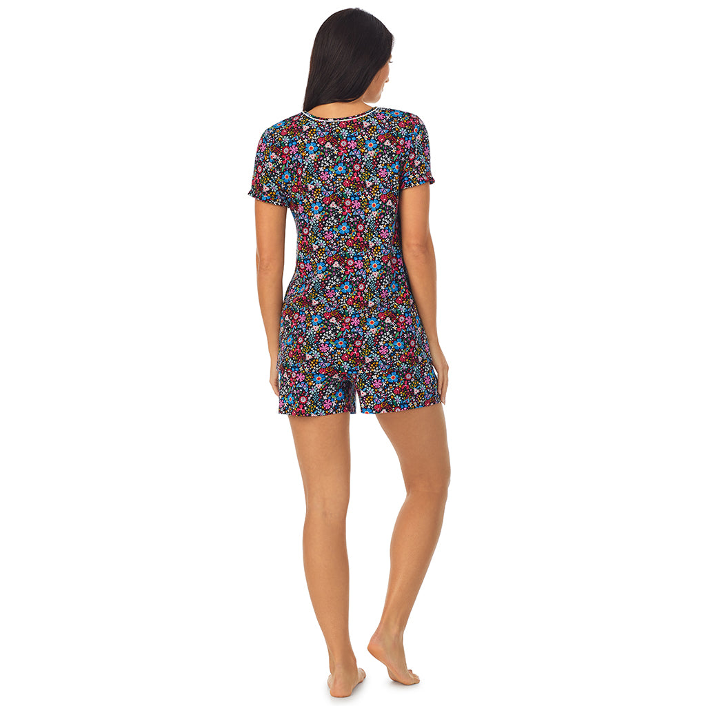 Spring Bloom; Model is wearing size S. She is 5'8.5", Bust 32", Waist 25", Hips 36". @ A lady wearing short sleeve top with boxer short pajama set with floral print