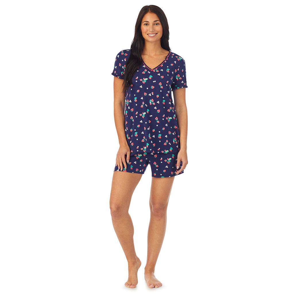 Strawberry Field; Model is wearing size S. She is 5'8.5", Bust 32", Waist 25", Hips 36". @ A lady wearing blue short sleeve top with boxer short pajama set with Strawberry Field print