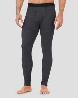 A man wearing a charcoal heather waffle thermal pant.