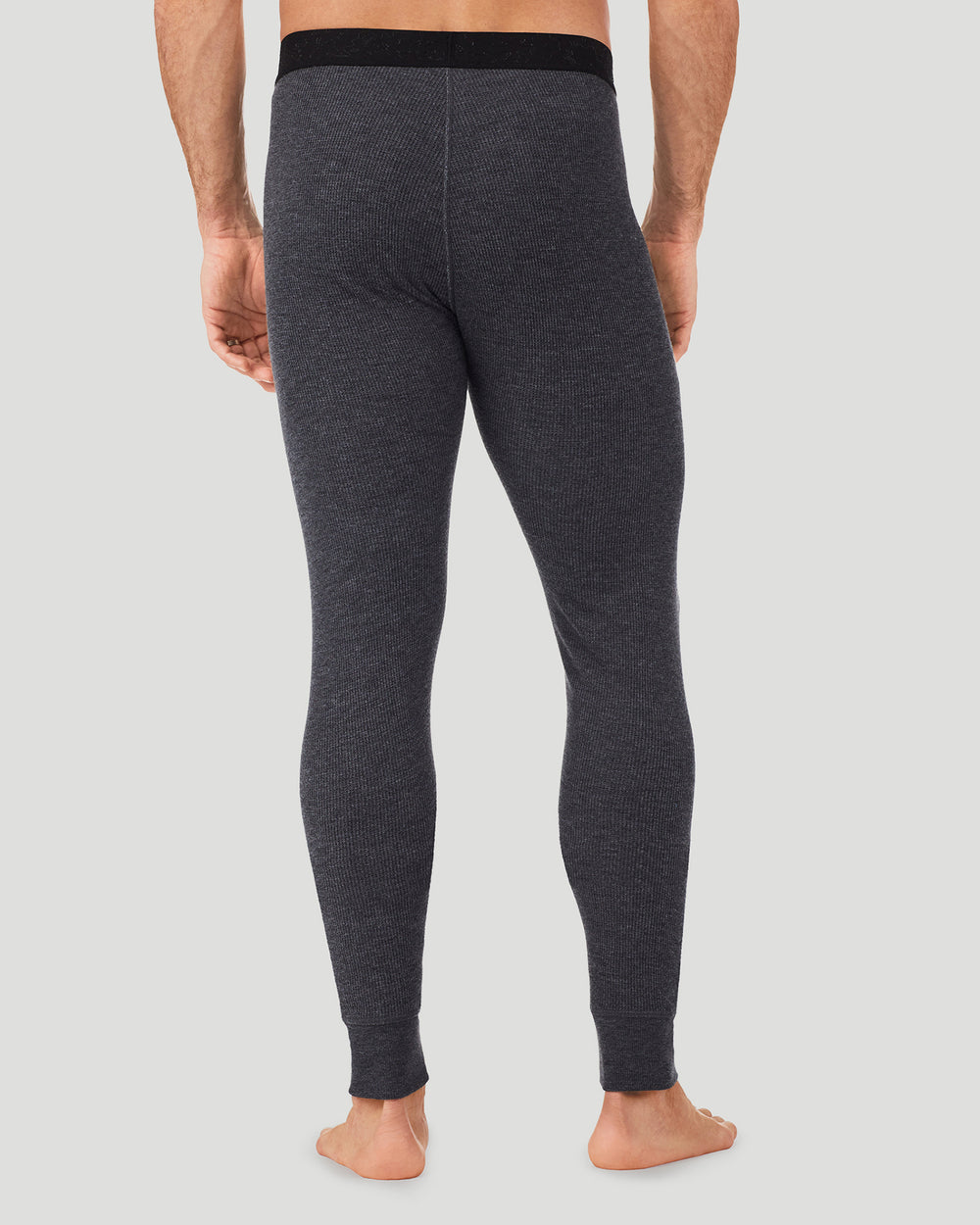 A man wearing a charcoal heather waffle thermal pant back view
