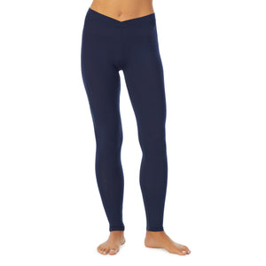 A lady wearing a Navy Blazer stretch legging.