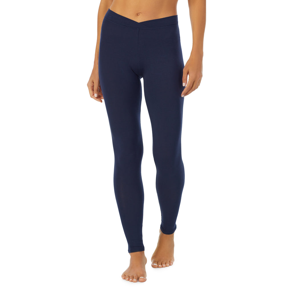 A lady wearing a Navy Blazer stretch legging.