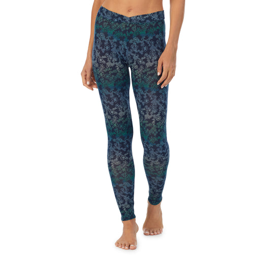 Blue Floral; Model is wearing size S. She is 5’9”, Bust 34”, Waist 25.5”, Hips 36.5”. @A lady wearing a Blue Floral stretch legging.
