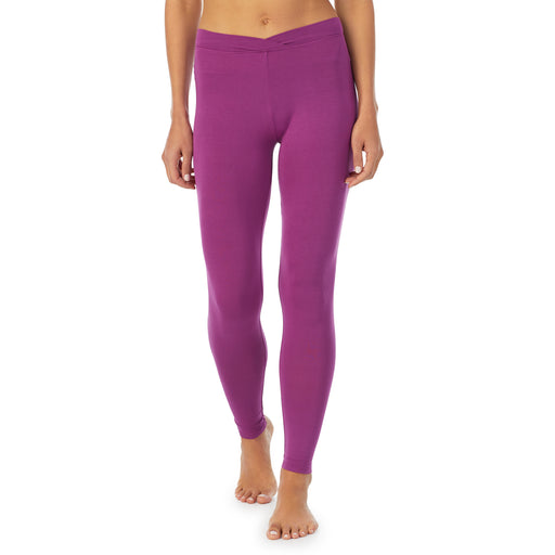 Purple Radiance; Model is wearing size S. She is 5’9”, Bust 34”, Waist 25.5”, Hips 36.5”. @A lady wearing a Purple Radiance stretch legging.