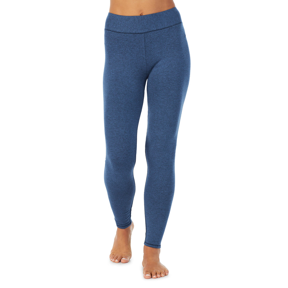 A lady wearing a Ultramarine Heather legging.