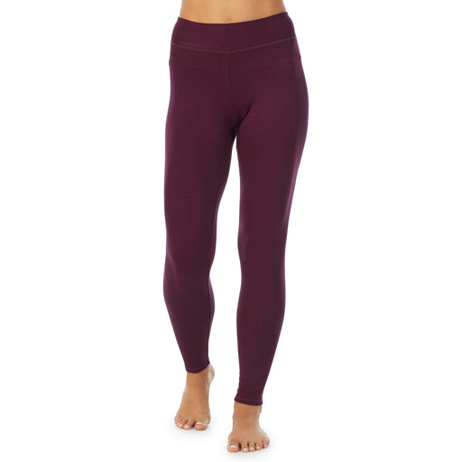Purple Beet Heather; Model is wearing size S. She is 5’9”, Bust 34”, Waist 25.5”, Hips 36.5”. @A lady wearing a Purple Beet Heather legging.