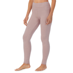A lady wearing a Mauve Shadow Heather legging.