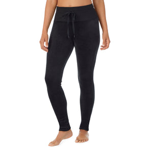 A lady wearing black stretch velour legging