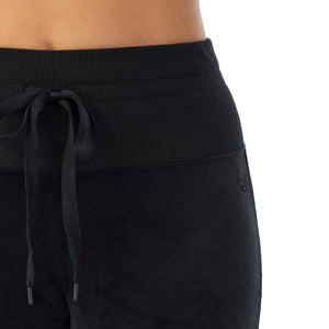 A lady wearing black stretch velour legging