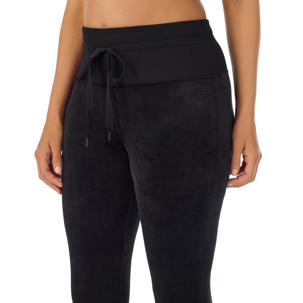 A lady wearing black stretch velour legging